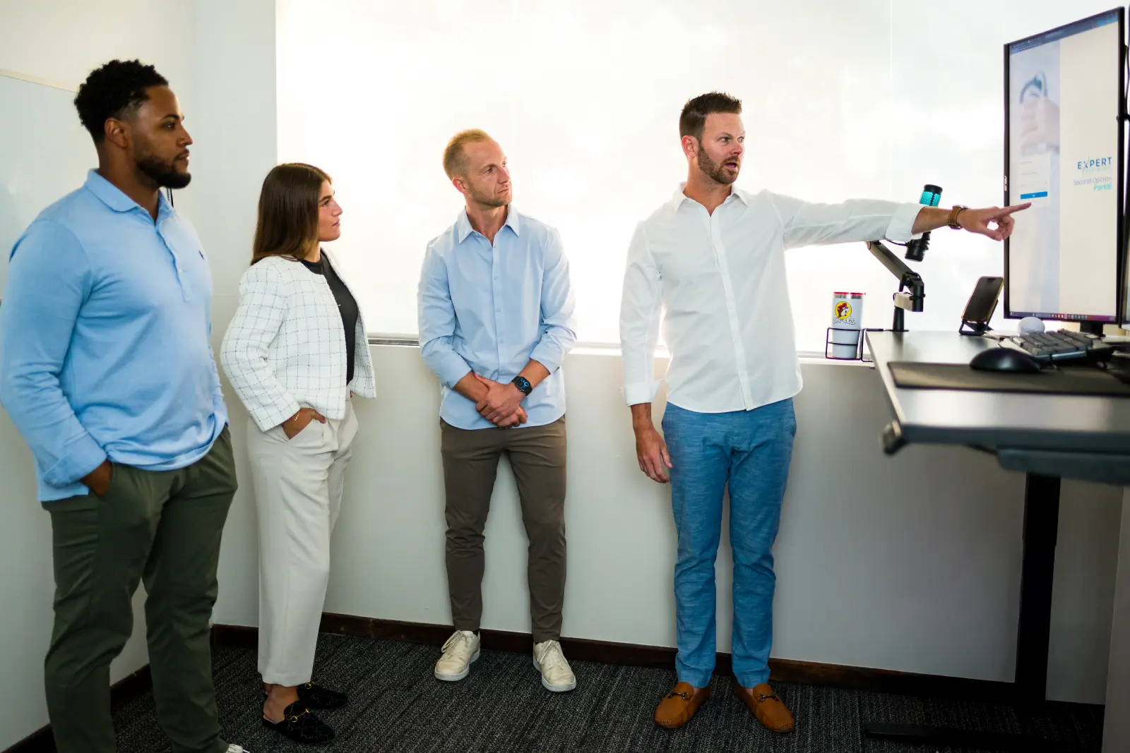 Expert Radiology team discussing portal workflow at a workstation