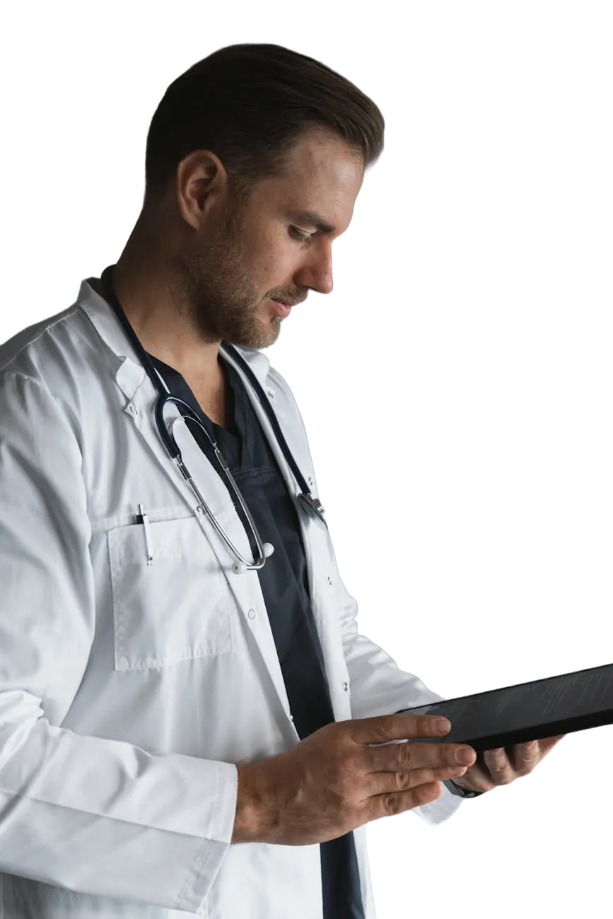 Doctor with stethoscope reviewing tablet