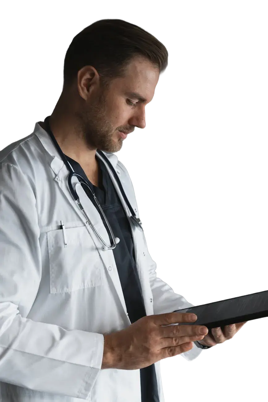 Doctor with stethoscope reviewing tablet